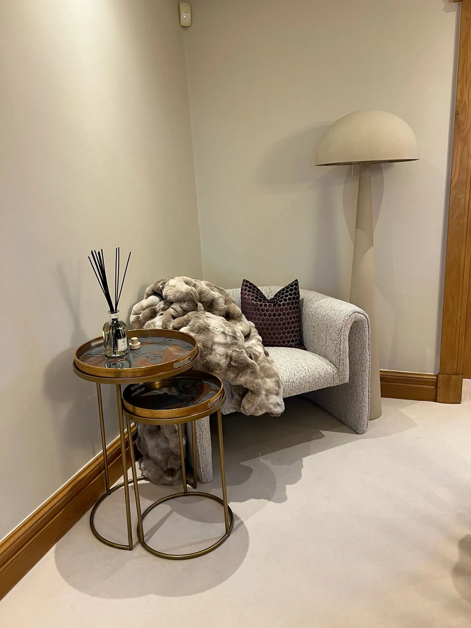 A beautifully styled interior vignette with luxury homeware pieces arranged on a surface.
