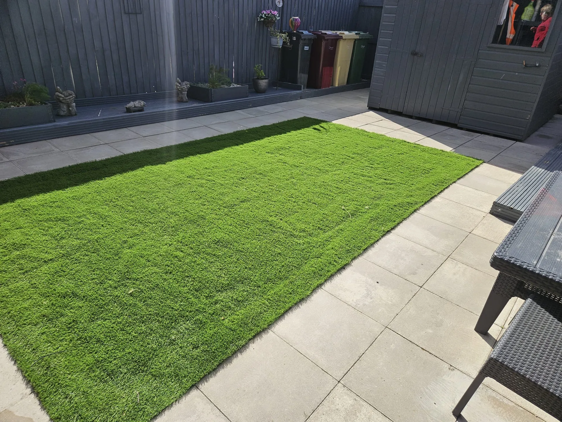 Premium artificial grass with modern paving