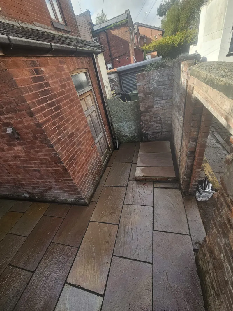 Indian sandstone paving leading to the outbuilding door