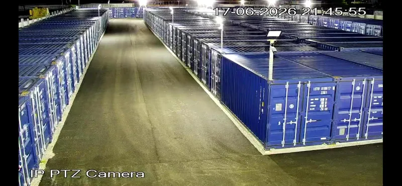 Self storage in Wirral: the lit aisle of storage containers with CCTV and lighting at Just Contain It, Corporation Road, Birkenhead