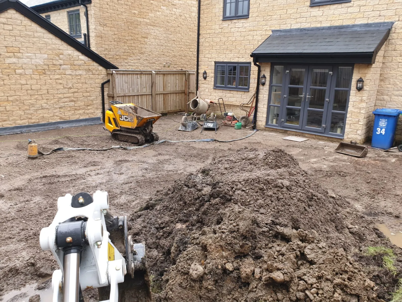Site preparation with mini excavator for residential groundworks project
