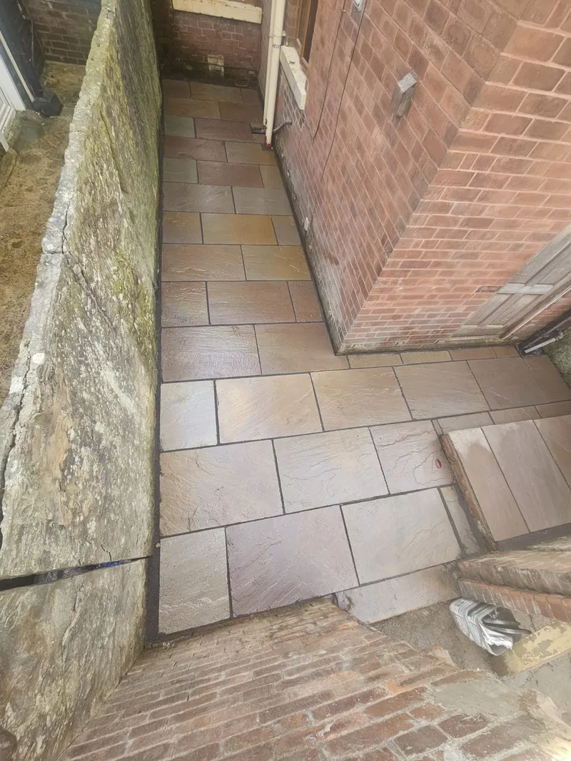 Finished Indian sandstone back yard paving in Bolton
