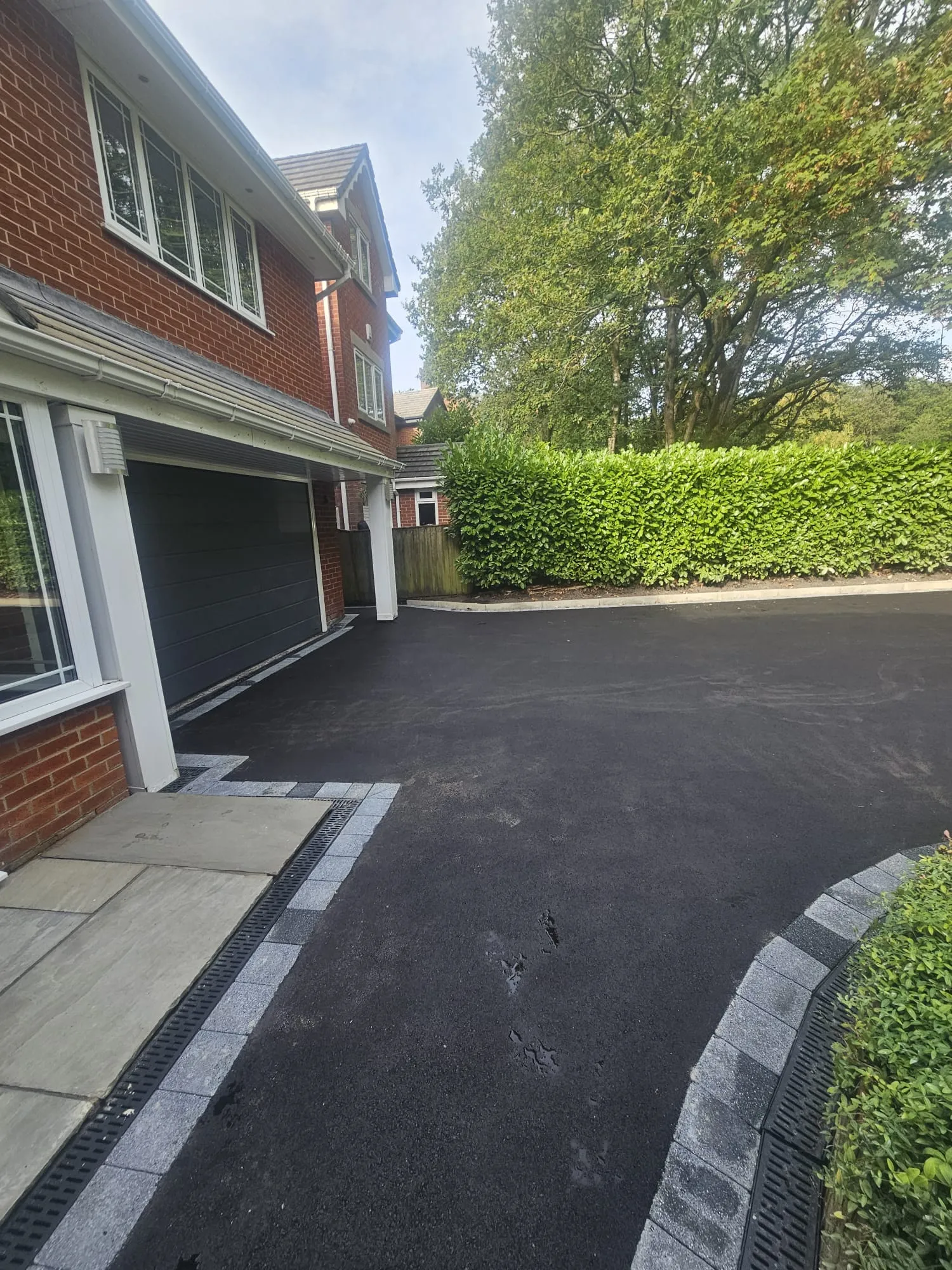 New tarmac driveway with granite sett edging in Horwich