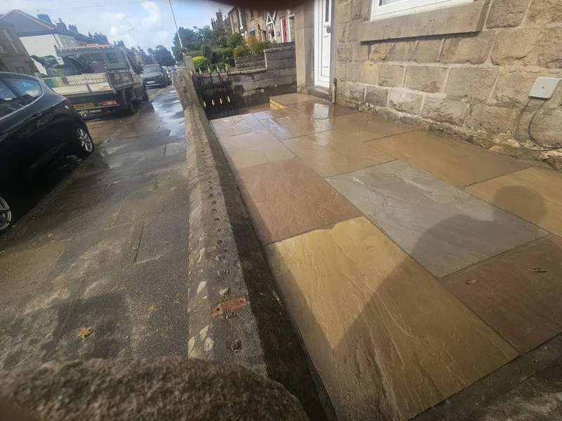 Indian sandstone paving across the front of a terraced house in Adlington