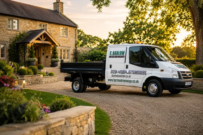 Professional landscaper working on driveway installation showing quality workmanship and attention to detail
